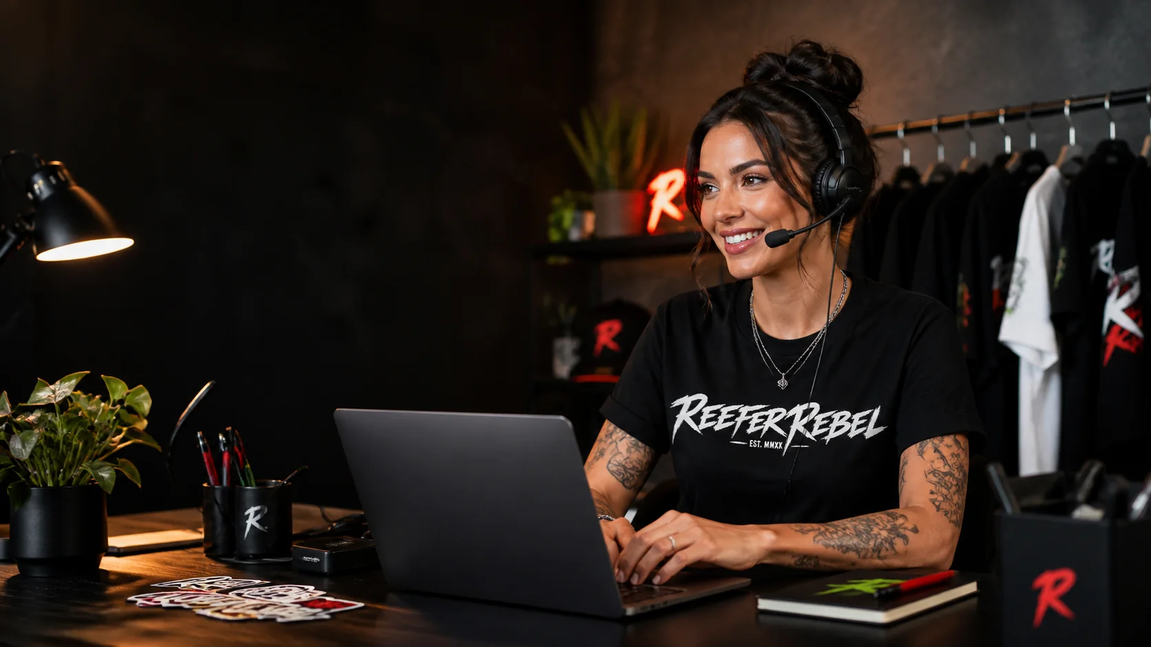 Reefer Rebel support representative wearing a Reefer Rebel shirt in a creative support workspace.